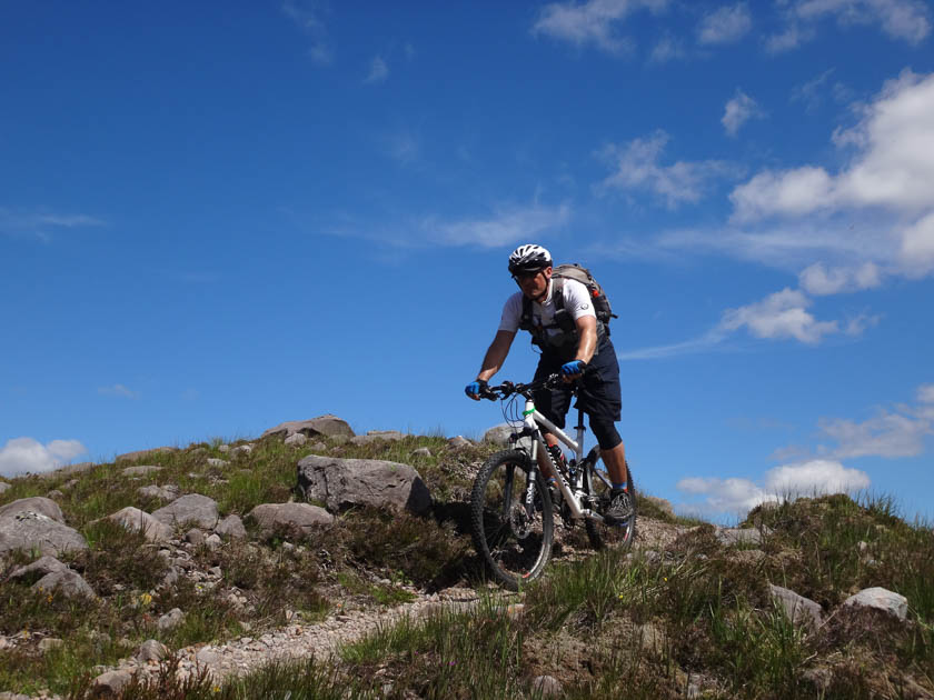 Gliding downhill by bike in the torridon landscape