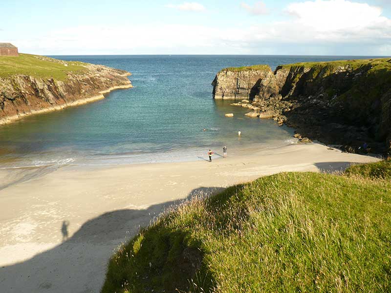 Looking down at the narrow entrance of the a secluded bay.