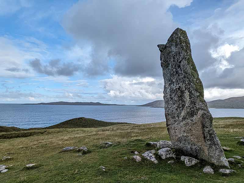 A solo standing stone overlooking the sea