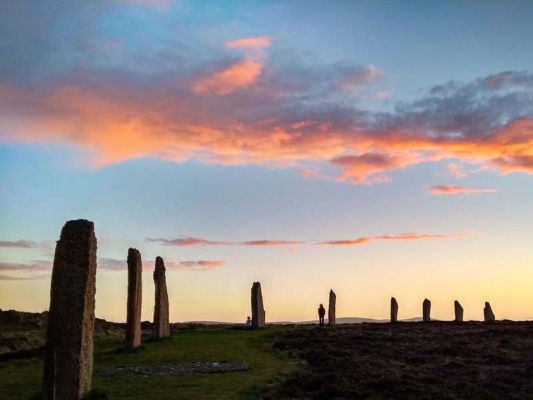 Pink and blue sunset over a stone circle
