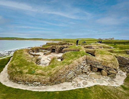 Overlooking the grass-topped stone wall foundations of the village of Skara Brae, more than 5,000 years old.