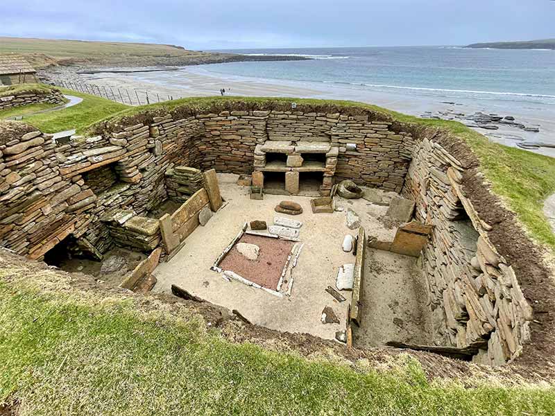 ruins of Skara Brae seen from above. A neolithic unesco world heritage site on the isle of orkney. stone ruins by the ocean